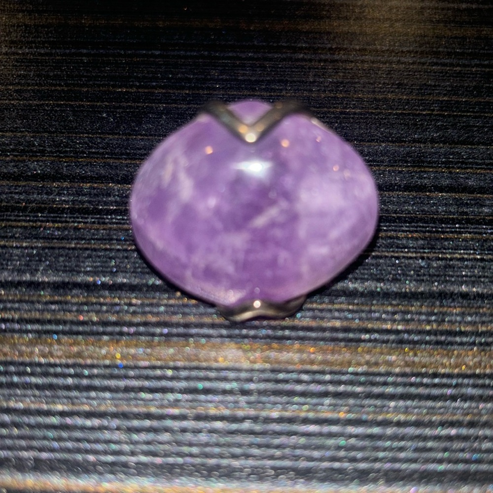 sterling silver ring with large amethyst center stone and elaborate band design